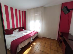 Postel nebo postele na pokoji v ubytování Hostal San Andrés