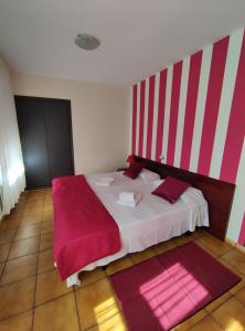 Postel nebo postele na pokoji v ubytování Hostal San Andrés
