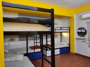 Postel nebo postele na pokoji v ubytování HOSHTEL99 - PRIME - Stay, Cowork & Connect