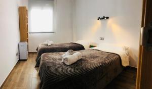 Postel nebo postele na pokoji v ubytování Low cost rooms La Merced + 11 fotografií