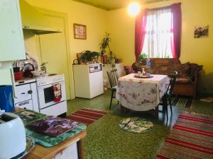 a living room with a table and a kitchen at Charming 1-Bed studio in Avesta in Avesta