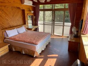 Voodi või voodid majutusasutuse Xi Zhi Tou Homestay toas