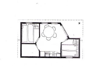a floor plan of a bedroom with a bed at Ristinge Ferielejligheder in Humble