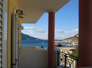 a balcony with a view of the water at Costareli in Fourni Ikarias