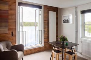a living room with a table and a window at Upperud 9:9 in Åsensbruk