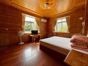 Voodi või voodid majutusasutuse Xi Zhi Tou Homestay toas