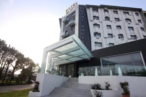 a building with stairs in front of a building at Hotel Santin in Pordenone