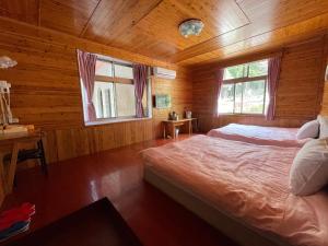 Voodi või voodid majutusasutuse Xi Zhi Tou Homestay toas