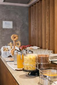 a kitchen counter filled with lots of food at Plaza Hotel, Philian Hotels and Resorts in Thessaloniki