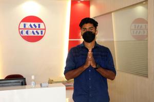 a man standing with a mask on his face at East Coast in Trivandrum