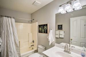 a bathroom with a sink and a toilet and a shower at Game Room and Pool Spacious Queen Creek Home! in Queen Creek
