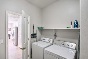 a white laundry room with a washer and dryer at Game Room and Pool Spacious Queen Creek Home! in Queen Creek