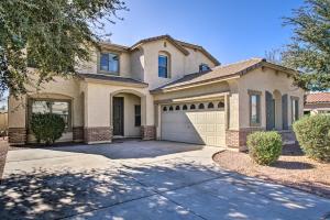 a house with a driveway and a garage at Game Room and Pool Spacious Queen Creek Home! in Queen Creek