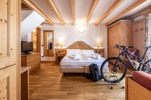 Voodi või voodid majutusasutuse Hotel Soreghes Gran Chalet toas