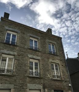 a brick building with windows on the side of it at Cherbourg Sea Sand in Cherbourg en Cotentin
