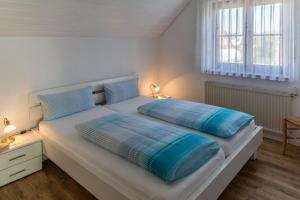 Ліжко або ліжка в номері 2 Zimmer Ferienwohnung Baur Nr 1