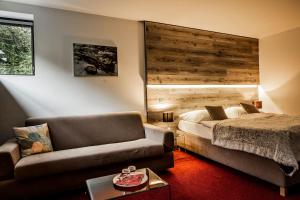 Postel nebo postele na pokoji v ubytování Hotel & Garden U Holubů