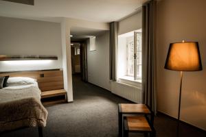 Postel nebo postele na pokoji v ubytování Hotel & Garden U Holubů