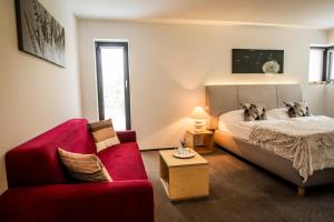 Postel nebo postele na pokoji v ubytování Hotel & Garden U Holubů