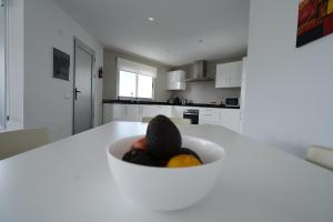 A kitchen or kitchenette at Casa Achaman - Contemporary style villa with outstanding views
