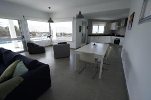 A kitchen or kitchenette at Casa Achaman - Contemporary style villa with outstanding views