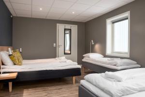 Postel nebo postele na pokoji v ubytování Fast Hotel Svolvær