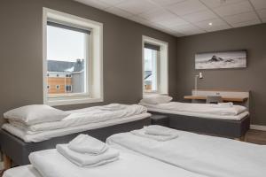 Postel nebo postele na pokoji v ubytování Fast Hotel Svolvær
