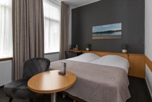Ein Bett oder Betten in einem Zimmer der Unterkunft Hotel Restaurant Mondriaan