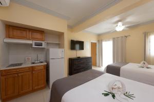 Voodi või voodid majutusasutuse Baker's Suites toas