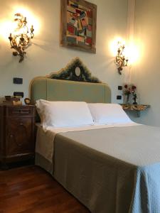 Postel nebo postele na pokoji v ubytování Agriturismo Collerisana