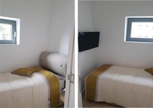 een slaapkamer met 2 bedden en een tv aan de muur bij Apartman Srebrena lisica - Babin do Bjelašnica Free Garage - Kanton Sarajevo in Bjelašnica