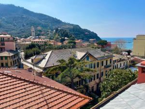 an aerial view of a city with buildings and the ocean at Blue Sky apartment - Levanto, 5 Terre in Levanto