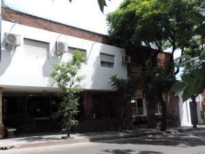 a white building on the side of a street at Hotel Español Salto in Salto