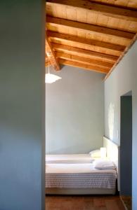 Voodi või voodid majutusasutuse Zefiros Traditional Hotel toas