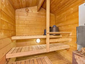 a wooden sauna in a log cabin at Holiday Home Santerin torppa by Interhome in Iitti