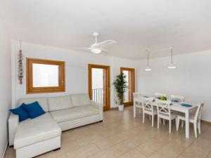 a living room with a white couch and a table at Apartment Blue Tossa by Interhome in Tossa de Mar