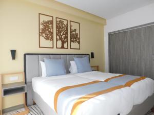 Postel nebo postele na pokoji v ubytování Gardenia Boutique Hotel + 37 fotografií