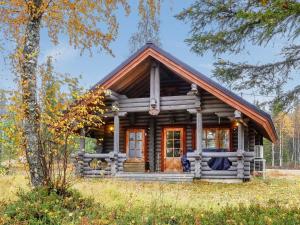 a log cabin in the woods at Holiday Home Lomaväinö 13 by Interhome in Salla