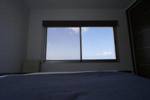 A bed or beds in a room at Casa Achaman - Contemporary style villa with outstanding views