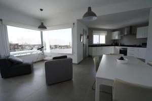 A kitchen or kitchenette at Casa Achaman - Contemporary style villa with outstanding views