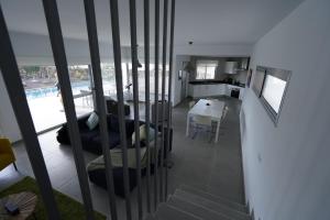 A television and/or entertainment centre at Casa Achaman - Contemporary style villa with outstanding views