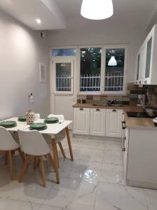A kitchen or kitchenette at Eytyhias Yard apartments in Poros