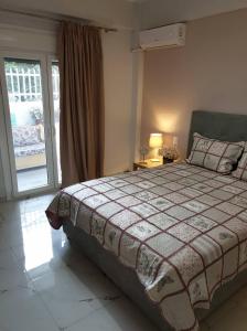 A bed or beds in a room at Eytyhias Yard apartments in Poros