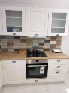 A kitchen or kitchenette at Eytyhias Yard apartments in Poros