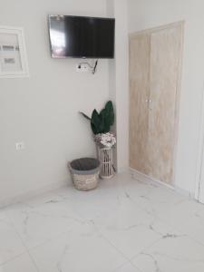 A television and/or entertainment centre at Eytyhias Yard apartments in Poros
