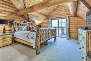 a bedroom with a bed and a wooden ceiling at Piedmont Cabin about 10 Mi to Rapid City! in Piedmont