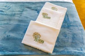 a pair of towels sitting on a blue towel at Oliveira Apartment`s in Porto +61 photos