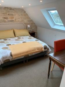 Uma cama ou camas num quarto em Brittany Vacation Rental