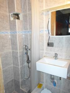 a bathroom with a sink and a shower at AZUL marino in Santiago +15 photos