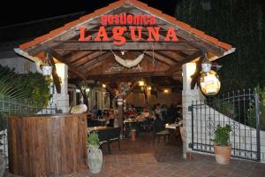 a restaurant with a sign that reads dysfunction laguna at Guesthouse Lopar (568) in Lopar